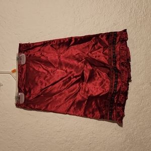 CUTE GIRL'S SATIN SKIRT WITH EMBROIDERED LACE DETAIL ON HEM AND ZIPPERED BACK.